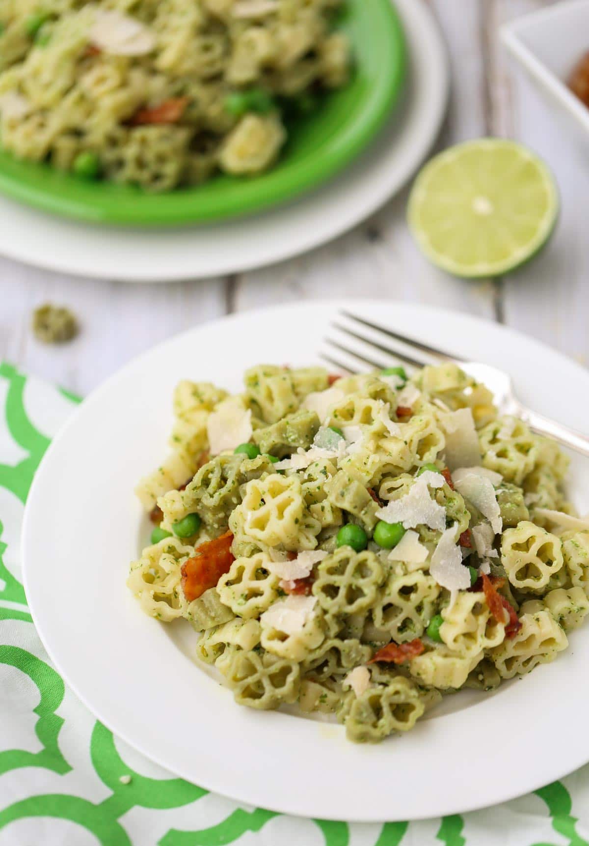 Arugula and Lime Pesto Pasta | A tangy and delicious combo for pesto! Add bacon, green peas, and make it your own! Yum! | WorldofPastabilities.com