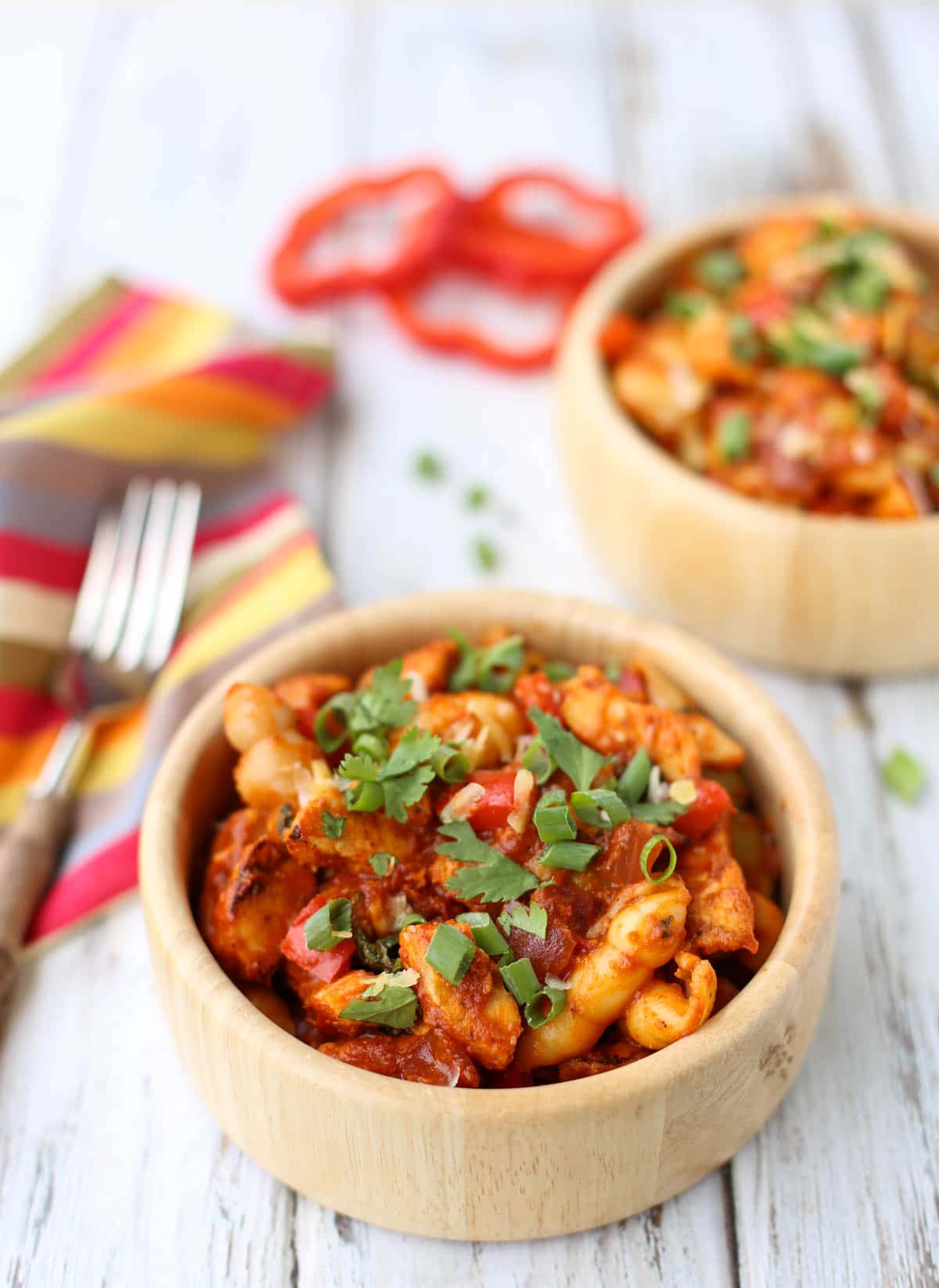 BBQ Chicken Pasta | Comfort food at its best! Cooked chicken with a marinara & BBQ sauce blend...topped with shredded gouda and provolone! Yum! and don't forget the chopped cilantro and green onions! | WorldofPastabilities.com