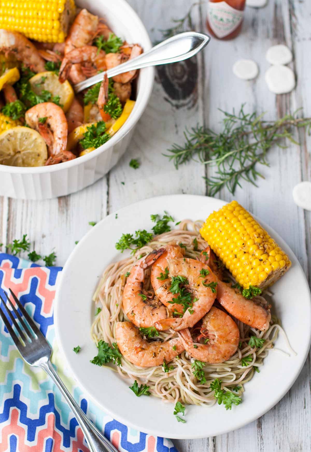 Bayou Shrimp Pasta | WorldofPastabilities.com | Zesty Cajun Bayou Shrimp Pasta is the must do beach recipe! Simple to make it delivers a ton of flavor. Get messy and have fun with the entire family!