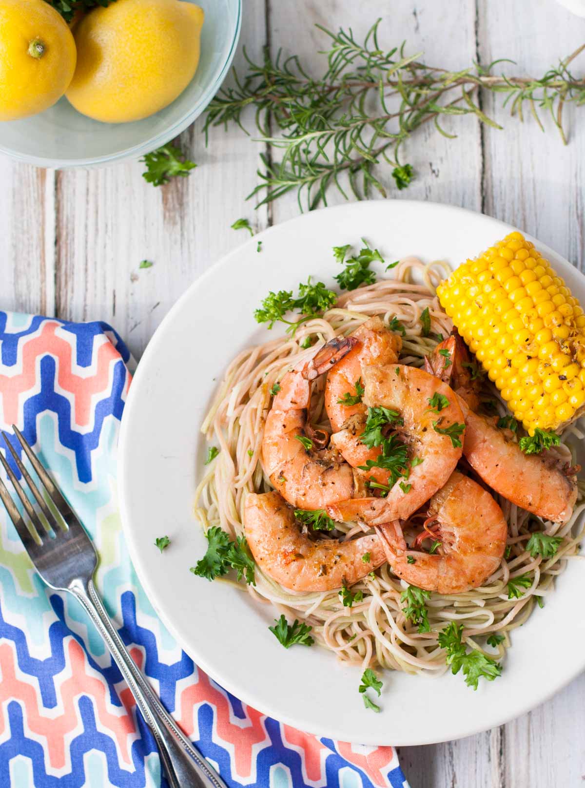 Bayou Shrimp Pasta | WorldofPastabilities.com | Zesty Cajun Bayou Shrimp Pasta is the must do beach recipe! Simple to make it delivers a ton of flavor. Get messy and have fun with the entire family!