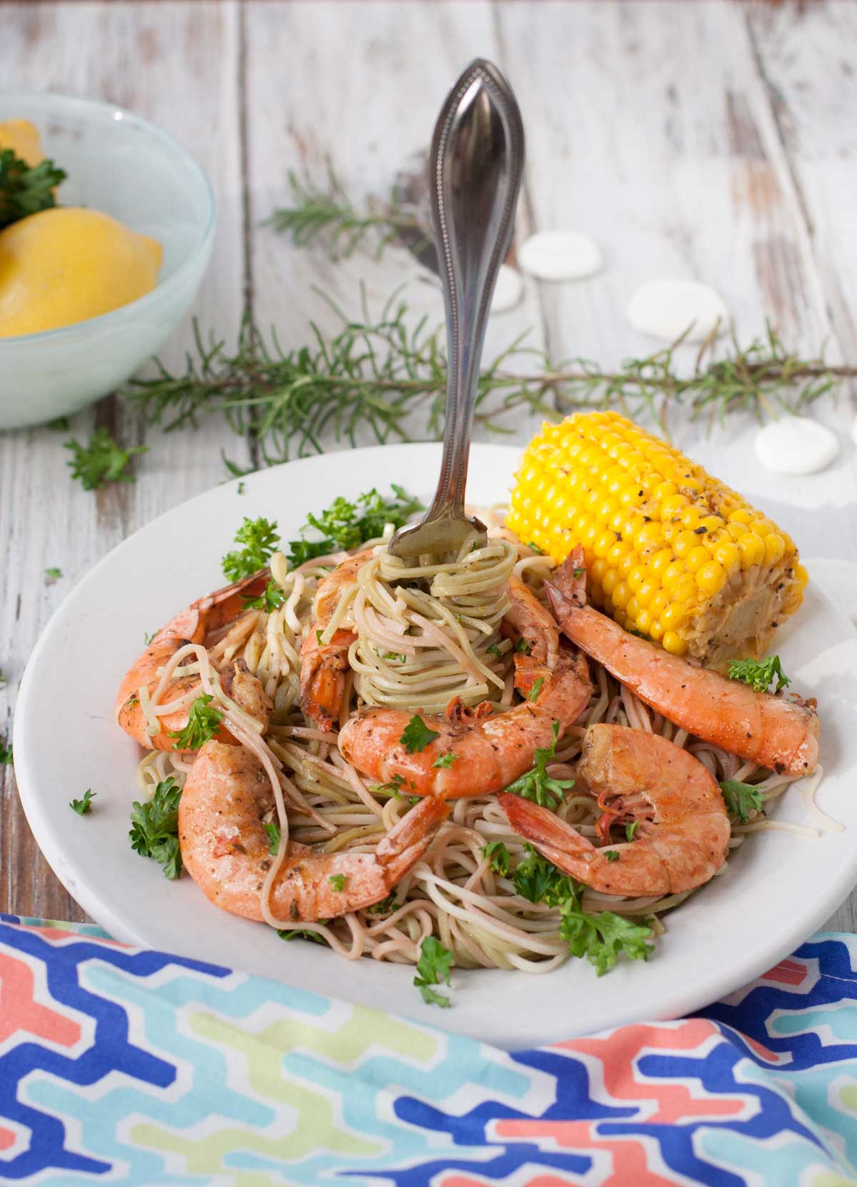 Bayou Shrimp Pasta | WorldofPastabilities.com | Zesty Cajun Bayou Shrimp Pasta is the must do beach recipe! Simple to make it delivers a ton of flavor. Get messy and have fun with the entire family!