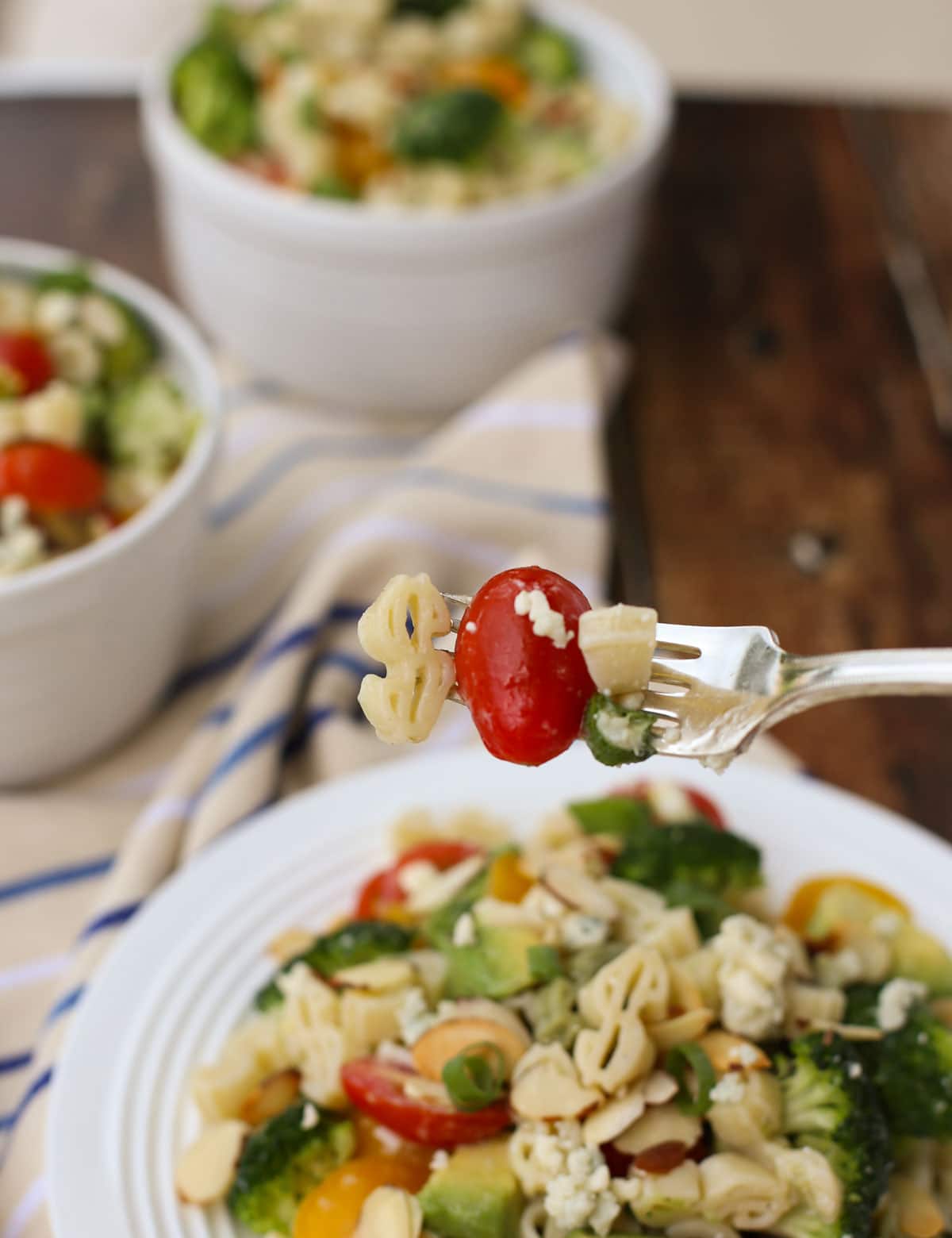 Blue Cheese Pasta Salad | Your favorite blue cheese veggies like cherry tomatoes and crunchy broccoli with toasted almonds and avocado! All tossed in a yummy blue cheese vinaigrette. Substitute feta for a lighter taste. Yum! | WorldofPastabilities.com