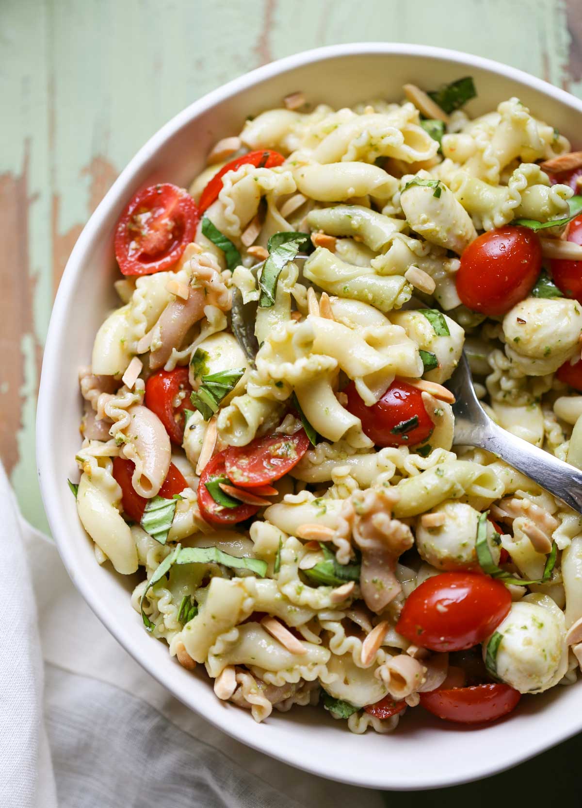 Caprese Pasta Salad | WorldofPastabilities.com | The perfect summer salad is fresh, simple, and a crowd favorite! You'll make this over and over!