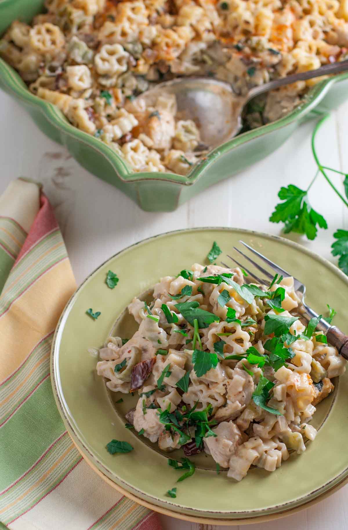 Creamy Chicken and Sun Dried Tomato Pasta | WorldofPastabilities.com | Delicious updated chicken casserole with bursts of flavor! Can be made ahead or frozen for later. Yum!