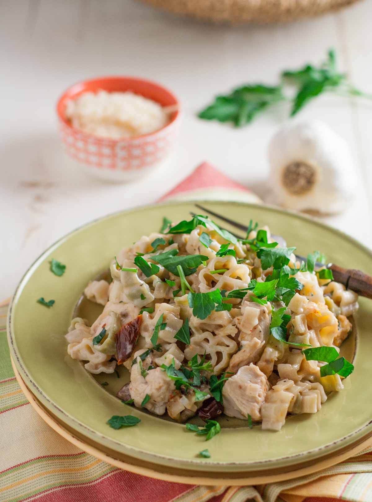 Creamy Chicken and Sun Dried Tomato Pasta | WorldofPastabilities.com | Delicious updated chicken casserole with bursts of flavor! Can be made ahead or frozen for later. Yum!