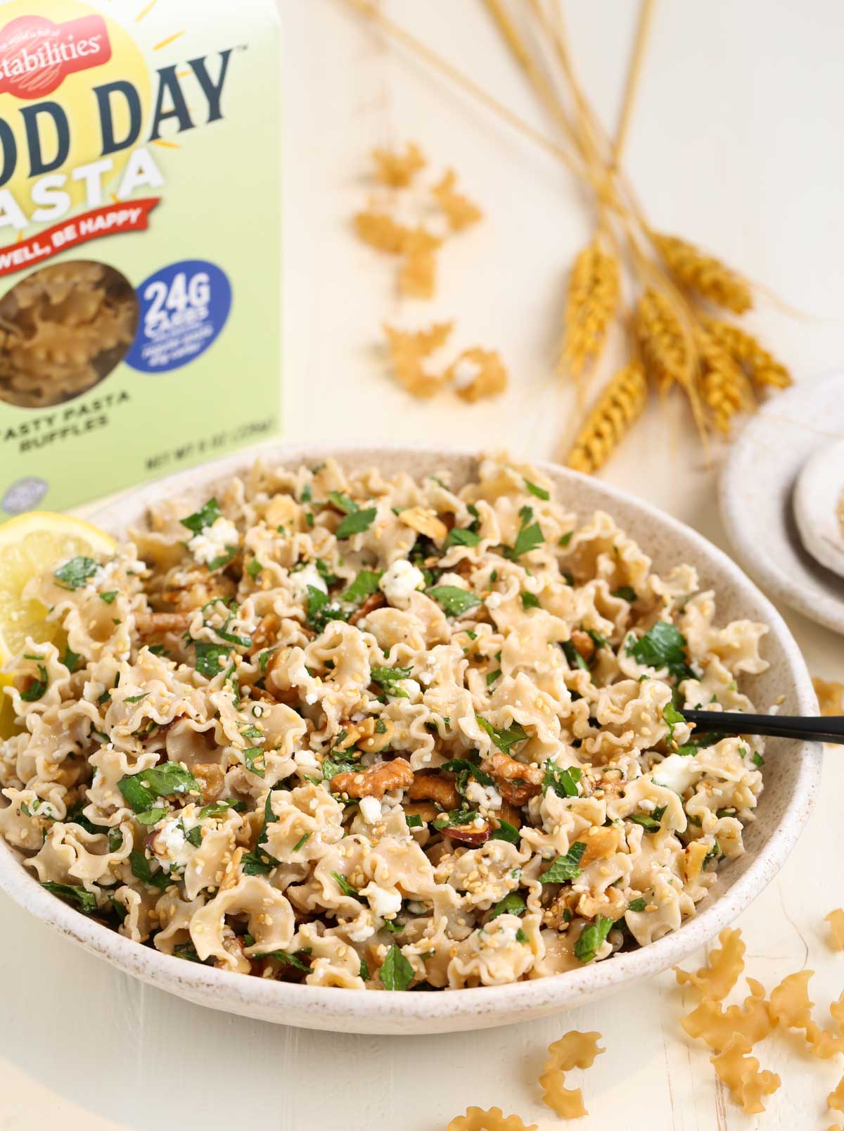 A bowl of Good Day Low Carb Pasta with a box showing in the background