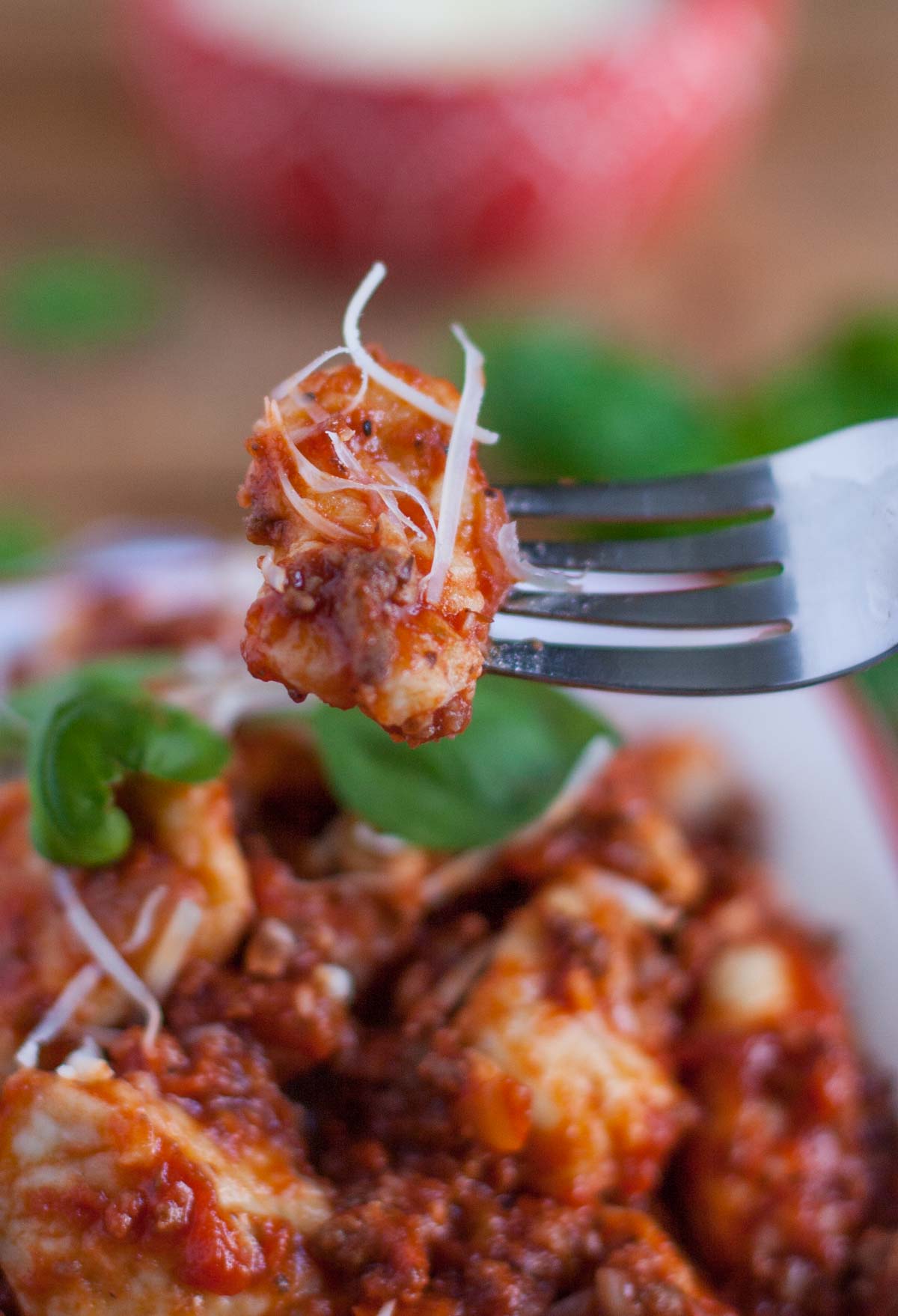 Homemade Gnocchi with Chunky Meat Sauce | WorldofPastabilities.com | Light and fluffy pillows of yumminess served with a chunky meat and sausage sauce. Easy to make - no special equipment needed!