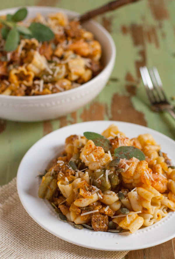 Italian Sausage and Pumpkin Pasta combines delicious fall flavors and textures. Pumpkin, Italian sausage, coconut milk, and spices create a hearty yet light pasta! Your tastebuds will love it! | WorldofPastabilities.com