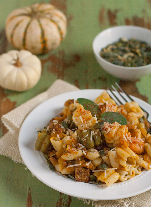 Italian Sausage and Pumpkin Pasta combines delicious fall flavors and textures. Pumpkin, Italian sausage, coconut milk, and spices create a hearty yet light pasta! Your tastebuds will love it! | WorldofPastabilities.com