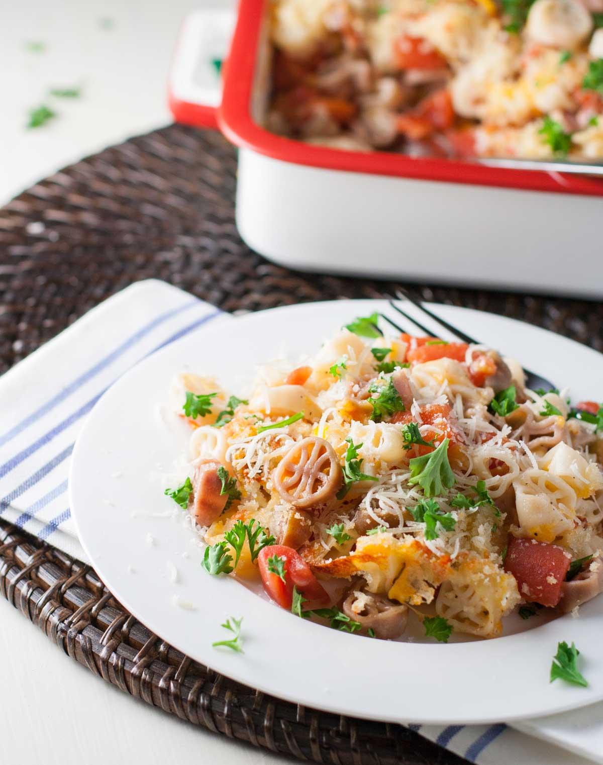 Light Mac and Cheese with Tomatoes | WorldofPastabilities.com | Fabulous mac and cheese side dish lightened up with less butter. Great flavor with herbs and panko on top!