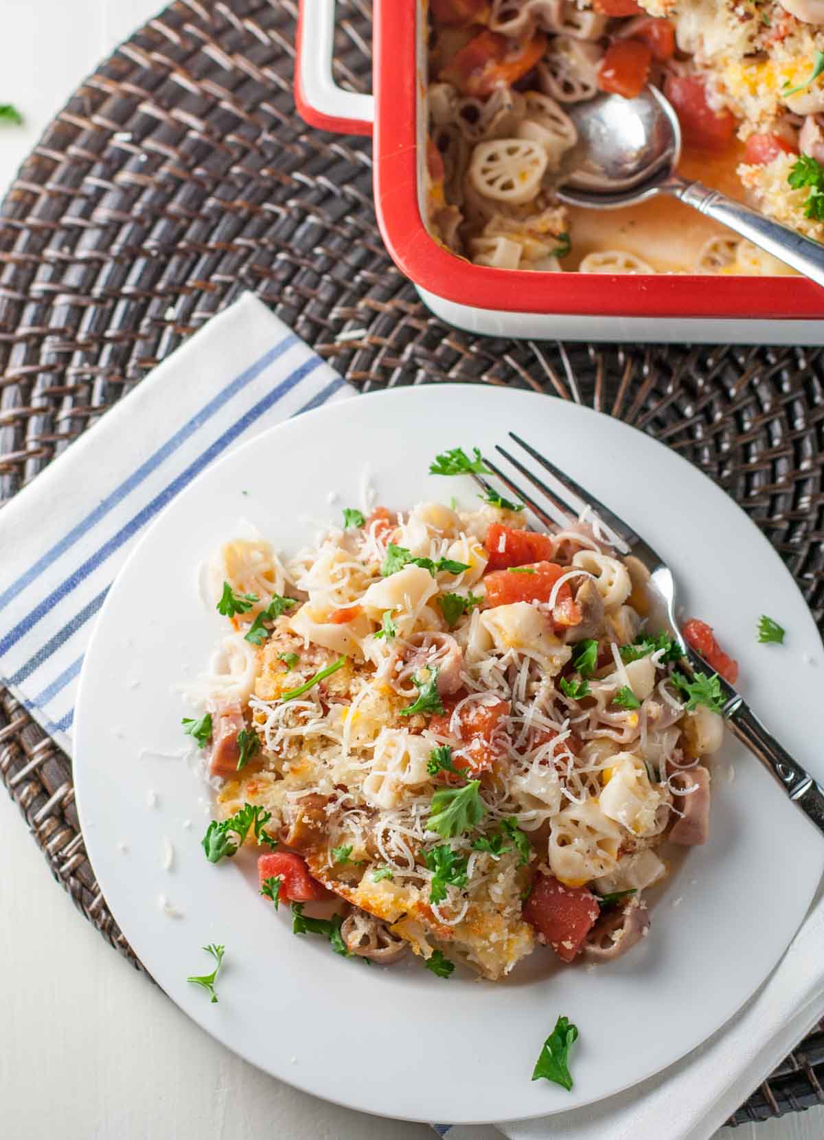 Light Mac and Cheese with Tomatoes | WorldofPastabilities.com | Fabulous mac and cheese side dish lightened up with less butter. Great flavor with herbs and panko on top!