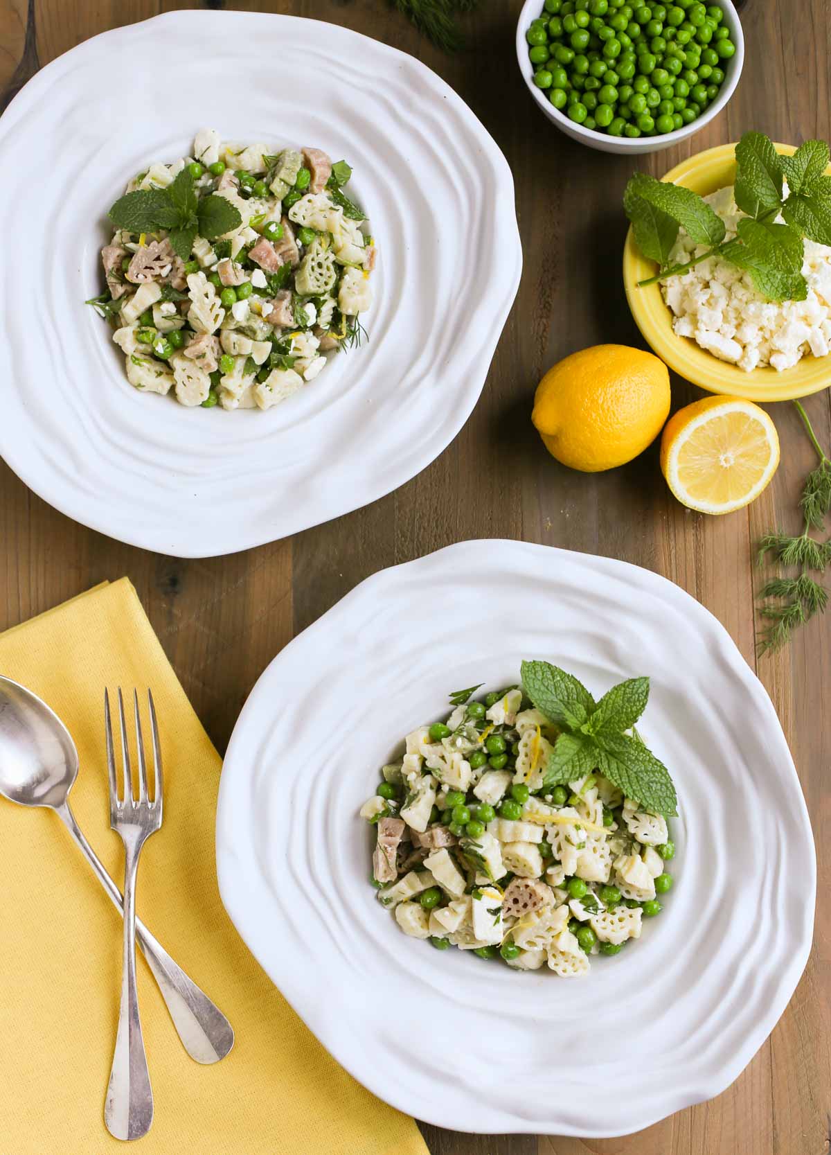 Light and Herby Mediterranean Pasta Salad | Lemon, Feta, and Fresh Chopped Herbs make this a light and delicious side dish! A tangy vinaigrette dressing ties it all together...yum! Great with any grilled meats or seafood! | WorldofPastabilities.com