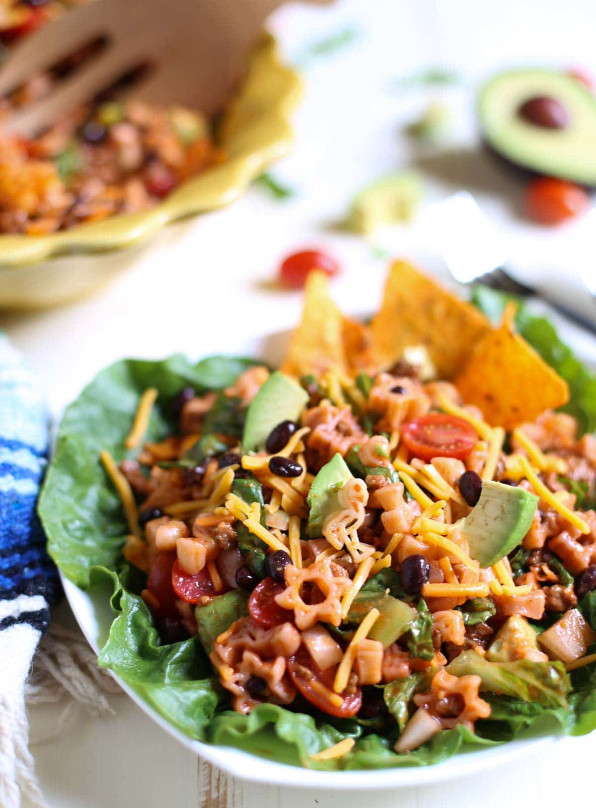 Mexican Chef Pasta Salad | Cha Cha Cha! Easy delish combo of sweet and tangy dressing with seasoned taco meat and fresh tomatoes, avocados and pasta. Add Doritos or corn chips - and the entire family goes crazy! A one pot yummy meal. Perfect for summer or beachside! | WorldofPastabilities.com