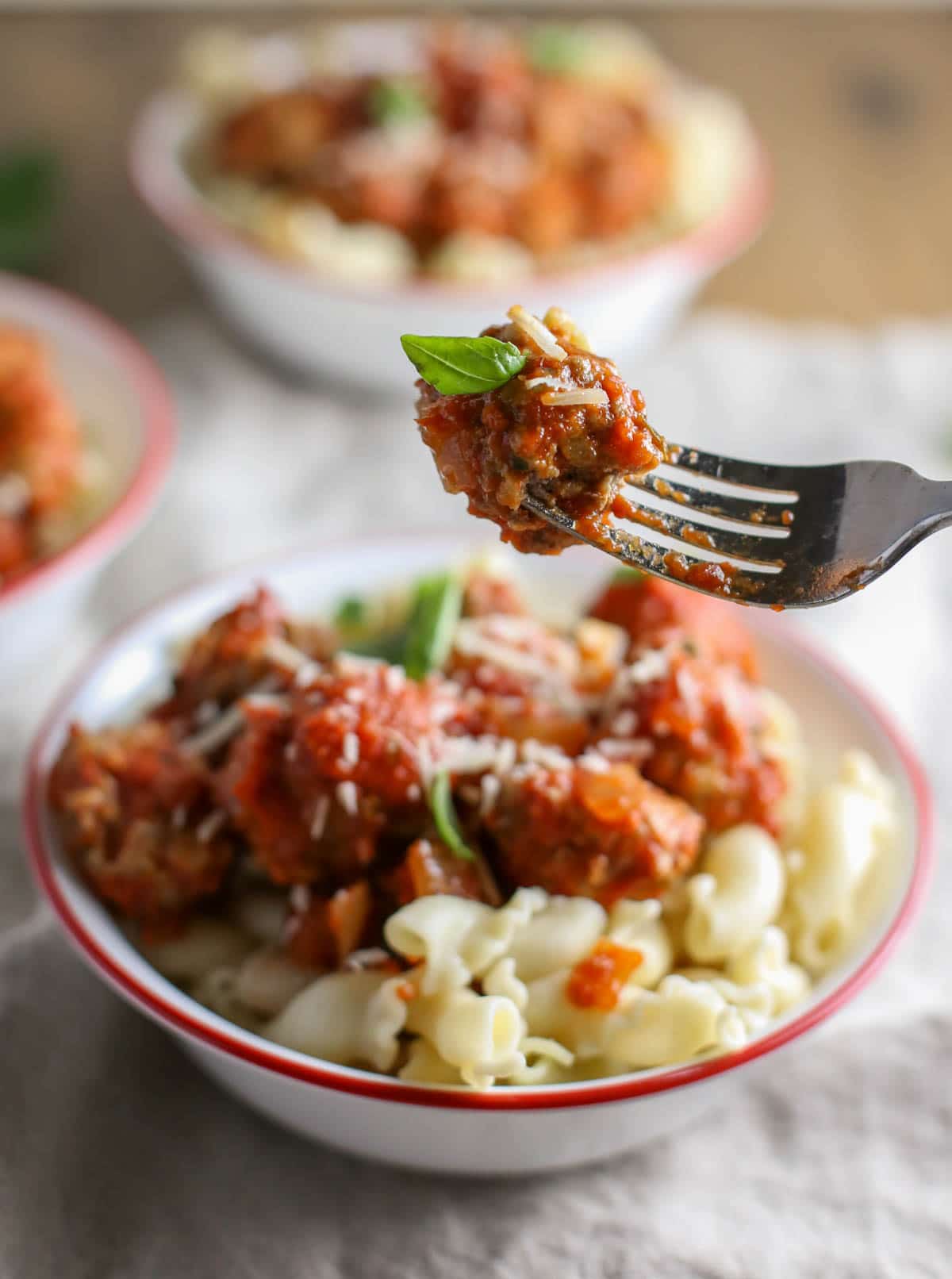 Mini Ricotta Meatballs with Herbed Tomato Suace| WorldofPastabilities.com | Moist, delicious, super simple recipe that they entire family will LOVE! Easy to freeze for later too!