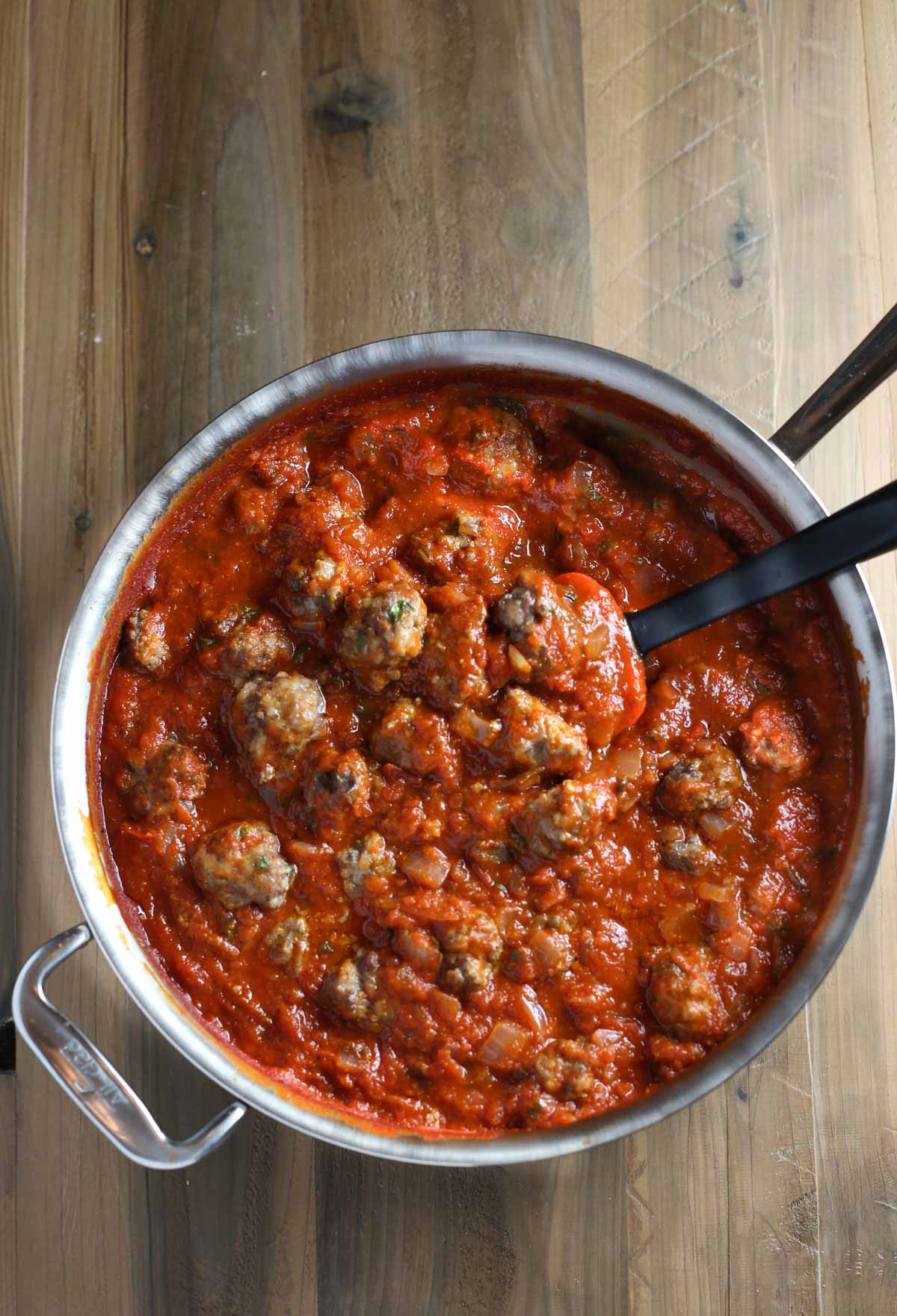 Mini Ricotta Meatballs with Herbed Tomato Suace| WorldofPastabilities.com | Moist, delicious, super simple recipe that they entire family will LOVE! Easy to freeze for later too!