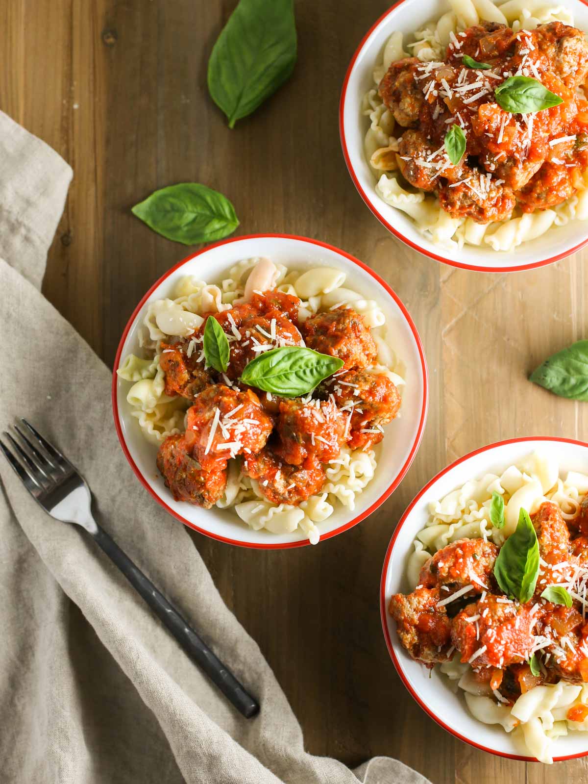 Mini Ricotta Meatballs with Herbed Tomato Sauce| WorldofPastabilities.com | Moist, delicious, super simple recipe that the entire family will LOVE! Easy to freeze for later too!
