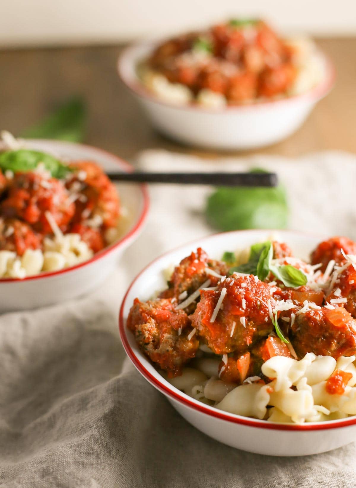 Mini Ricotta Meatballs with Herbed Tomato Suace| WorldofPastabilities.com | Moist, delicious, super simple recipe that they entire family will LOVE! Easy to freeze for later too!