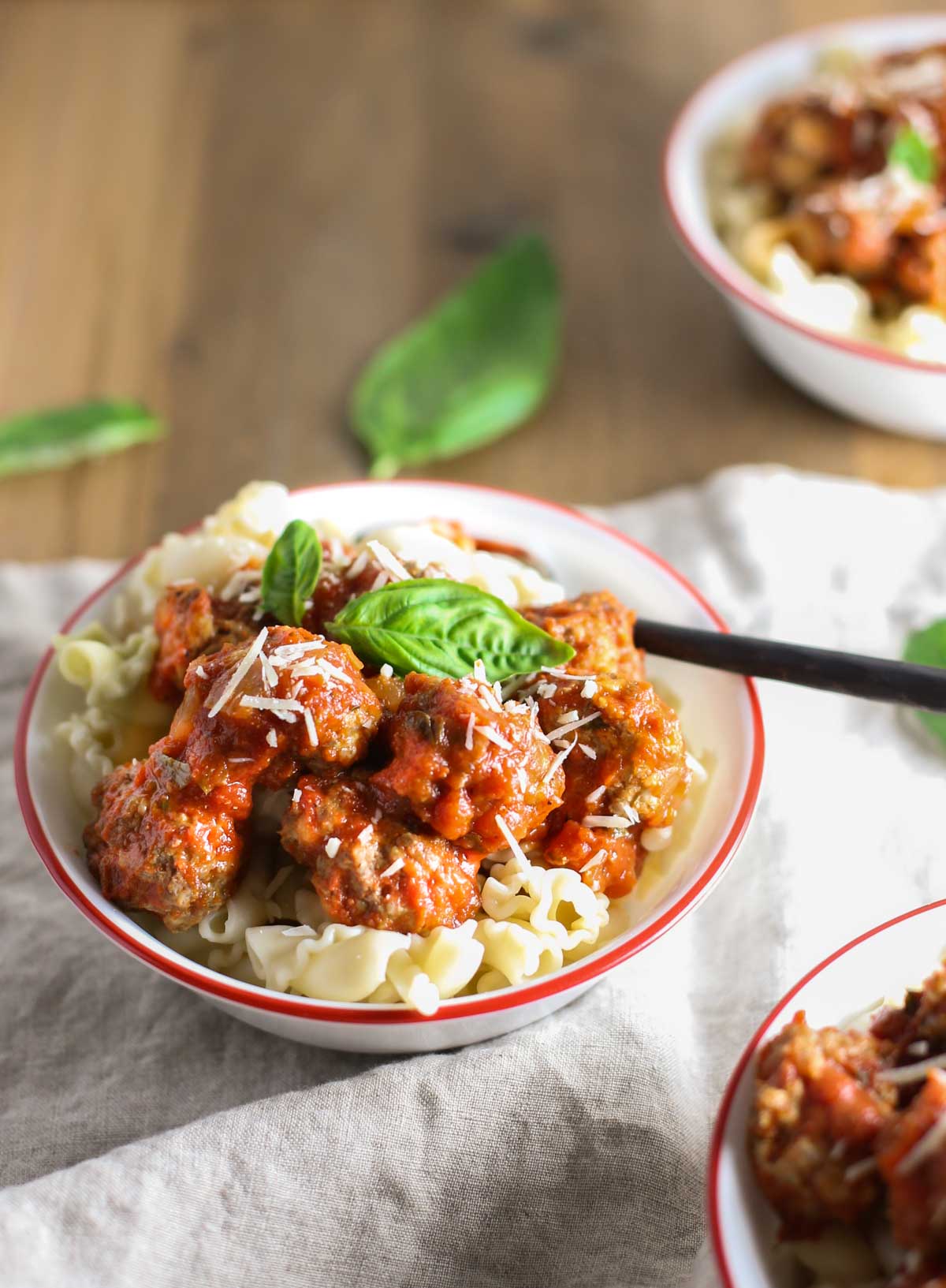 Mini Ricotta Meatballs with Herbed Tomato Suace| WorldofPastabilities.com | Moist, delicious, super simple recipe that they entire family will LOVE! Easy to freeze for later too!