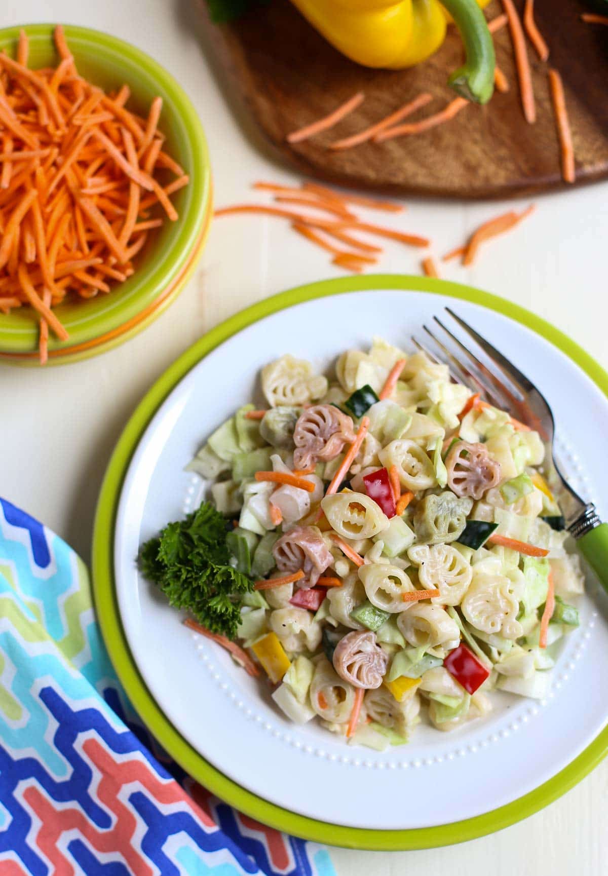 Pasta Slaw | BBQ's favorite side just got better! Pasta, cabbage, peppers, celery, etc plus a sweet and tangy sauce - it's a Wow! } WorldofPastabilities.com