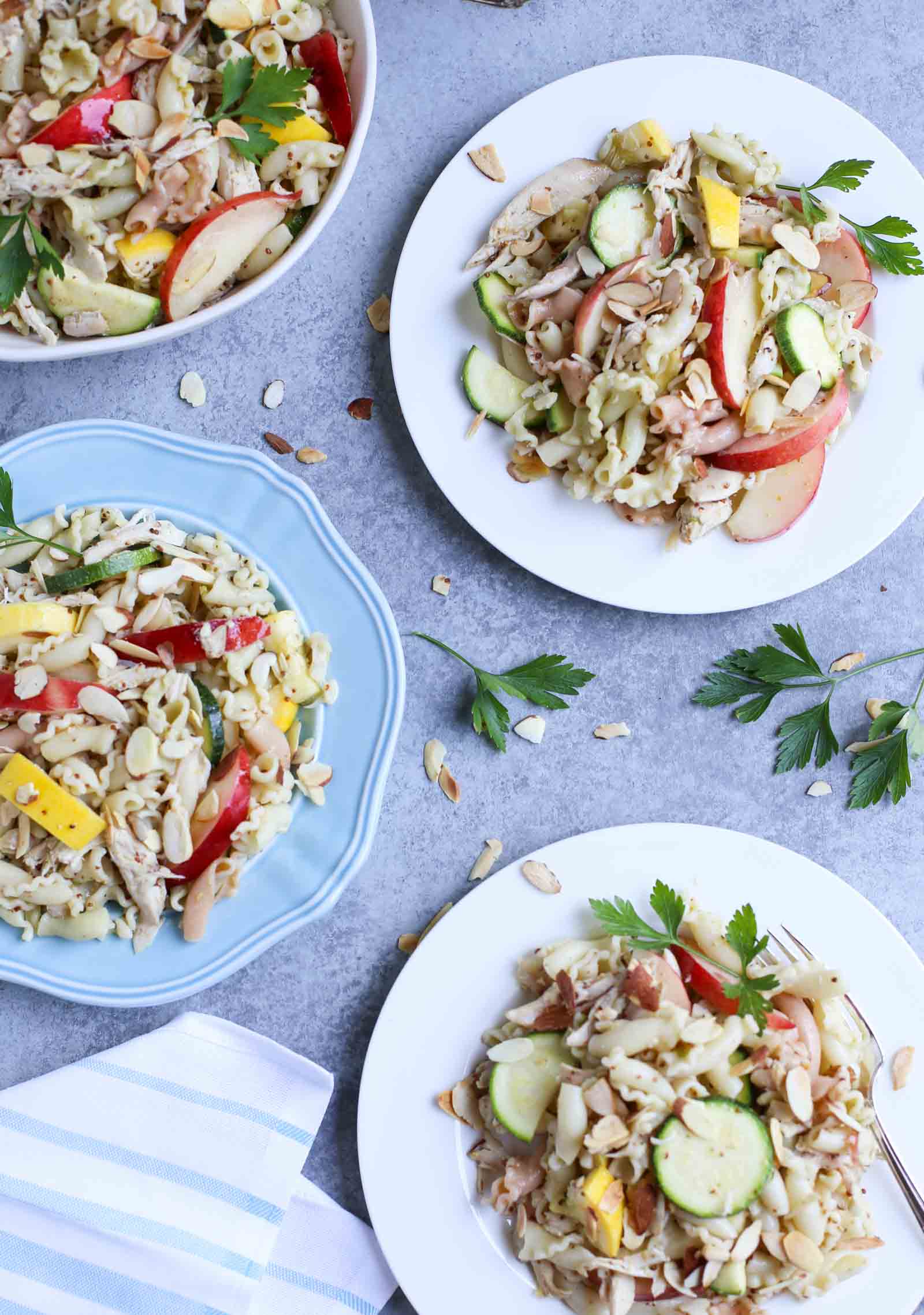 Summertime Chicken Pasta Salad with Nectarines & Squash | Tangy Lime Vinaigrette ties together a delicious unexpected surprise! Perfect as a main course and perfect for summer! Simple and delish! | WorldofPastabilities.com