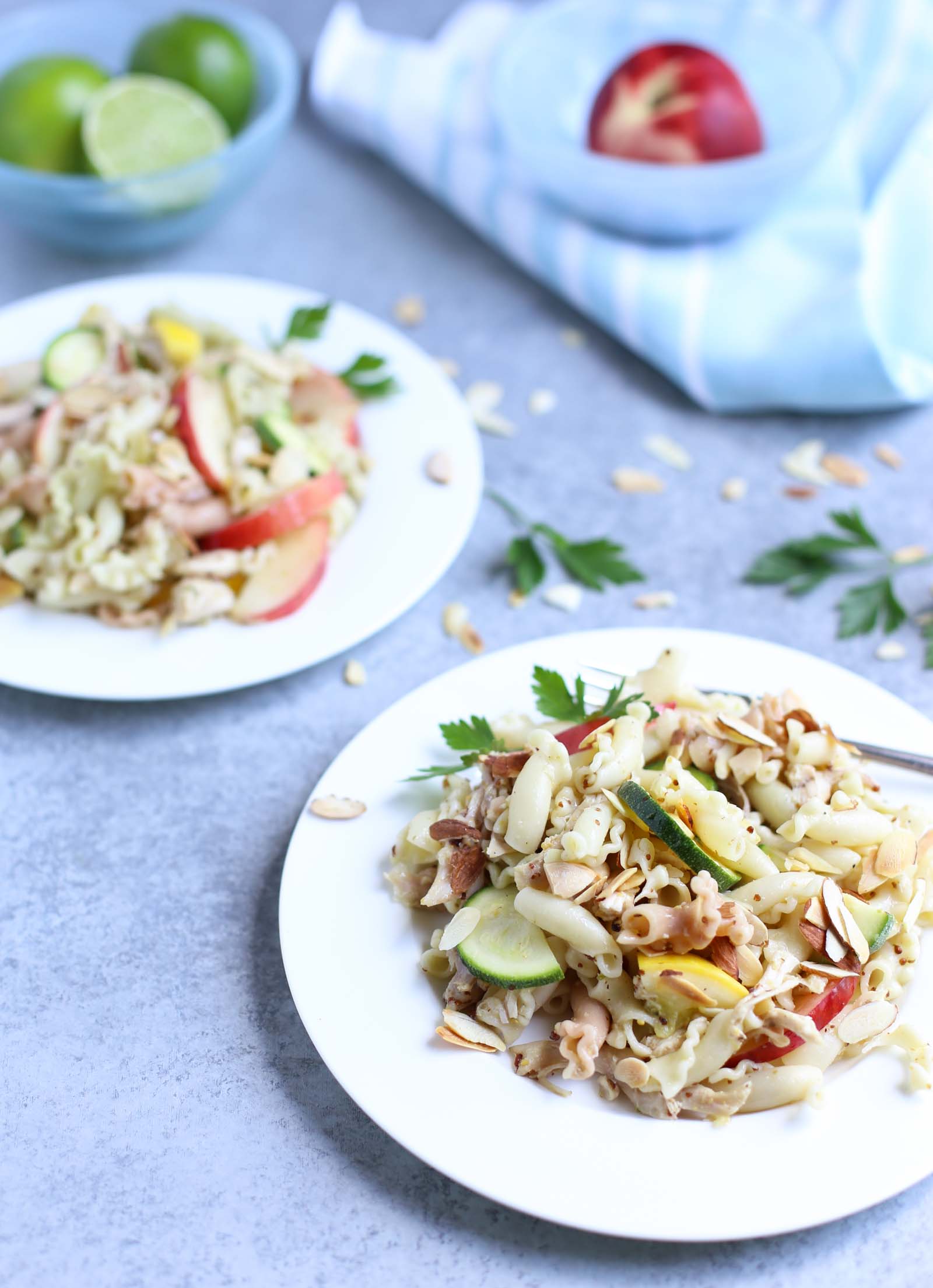 Summertime Chicken Pasta Salad with Nectarines & Squash | Tangy Lime Vinaigrette ties together a delicious unexpected surprise! Perfect as a main course and perfect for summer! Simple and delish! | WorldofPastabilities.com