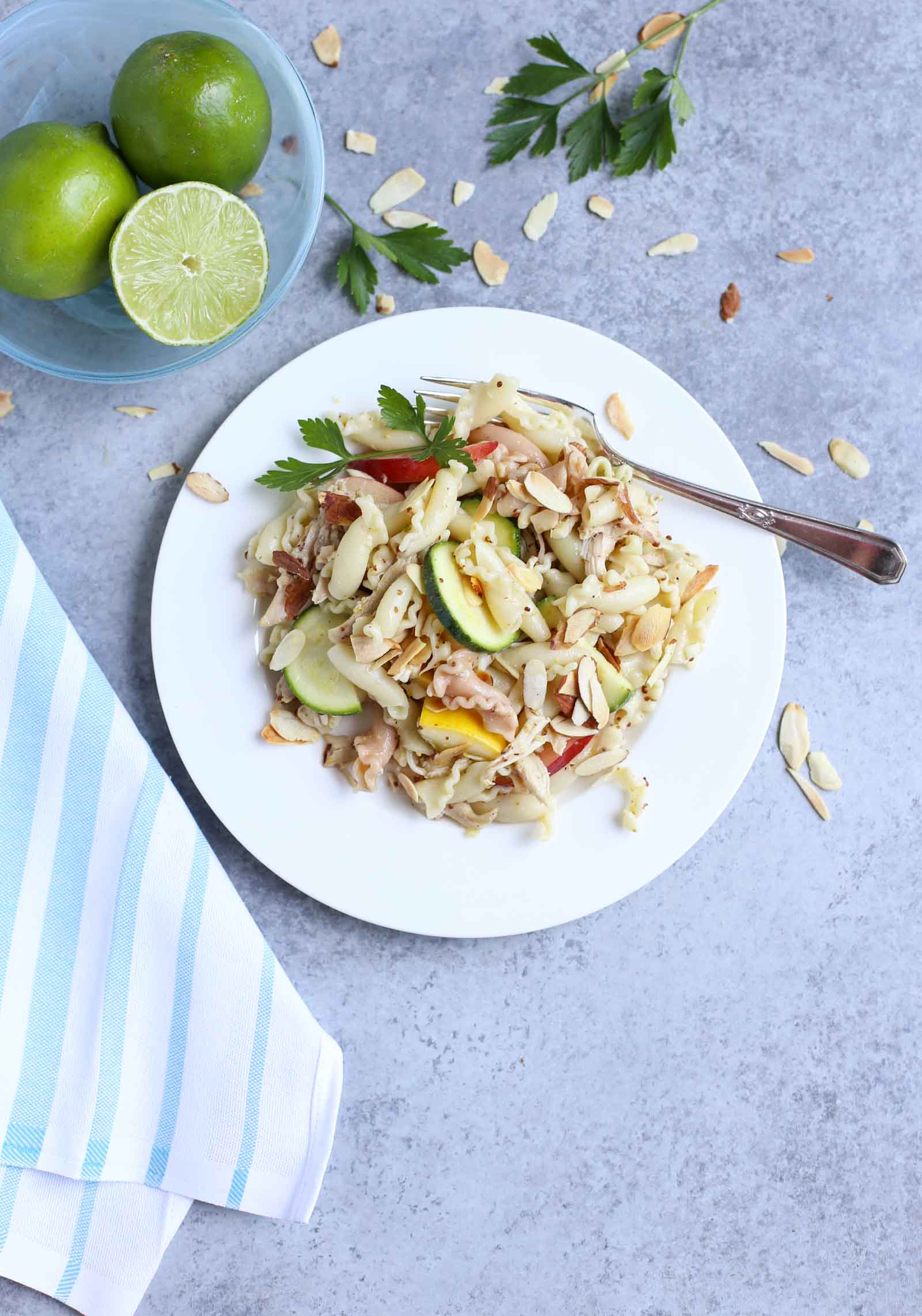 Summertime Chicken Pasta Salad with Nectarines & Squash | Tangy Lime Vinaigrette ties together a delicious unexpected surprise! Perfect as a main course and perfect for summer! Simple and delish! | WorldofPastabilities.com