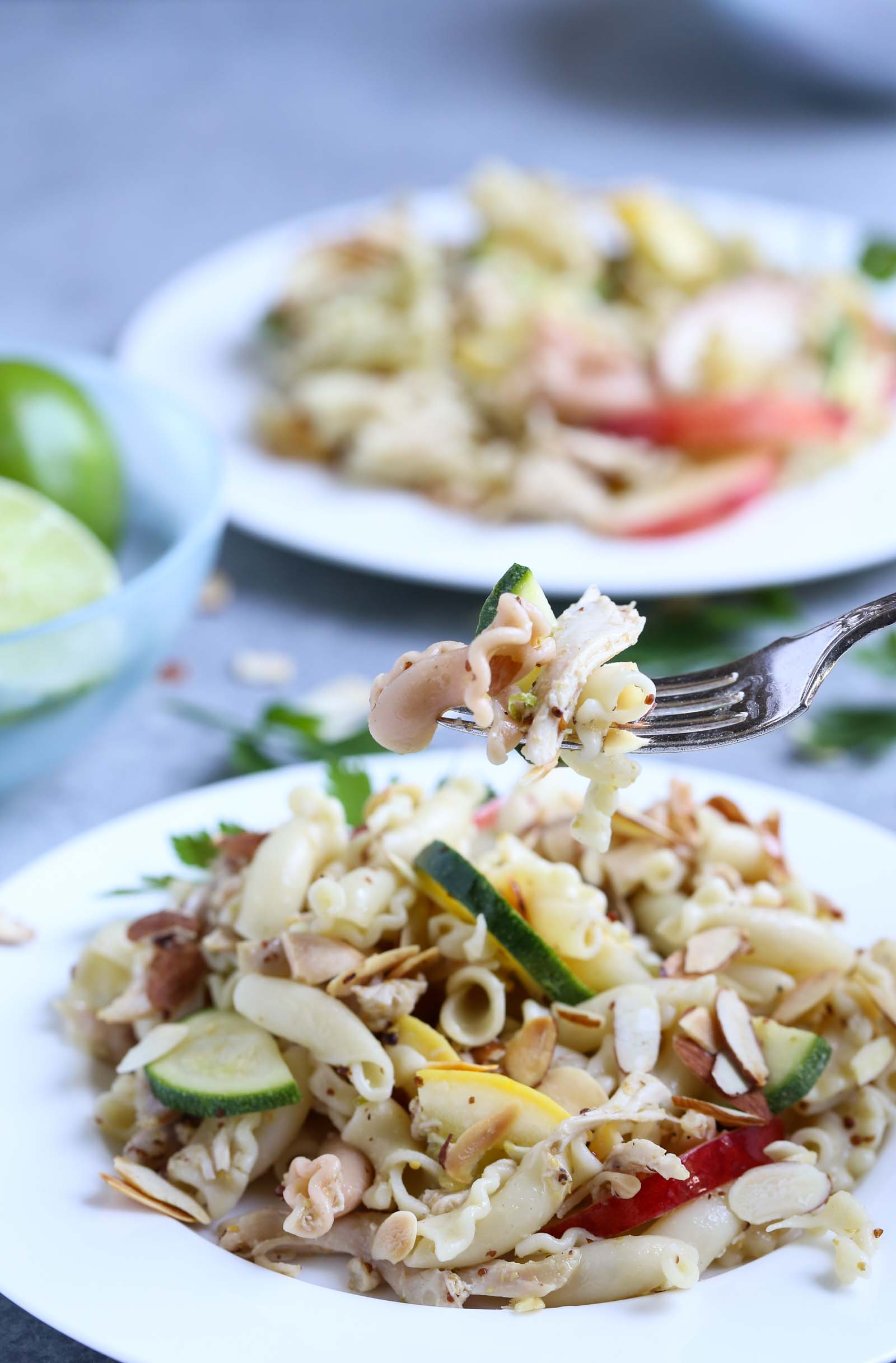 Summertime Chicken Pasta Salad with Nectarines & Squash | Tangy Lime Vinaigrette ties together a delicious unexpected surprise! Perfect as a main course and perfect for summer! Simple and delish! | WorldofPastabilities.com