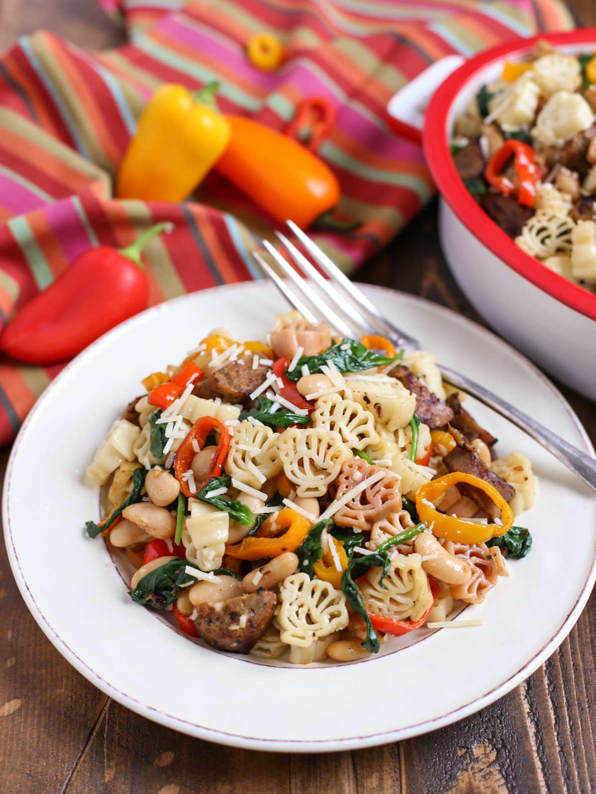 Veggie Sausage and Sweet Peppers with Turkey Pasta - a Thanksgiving Alternative! | Vegan Sausage, onions, colorful sweet peppers, fresh spinach and cannellini beans combine to make a delicious and hearty dish! | Add something new to your menu! | WorldofPastabilities.com