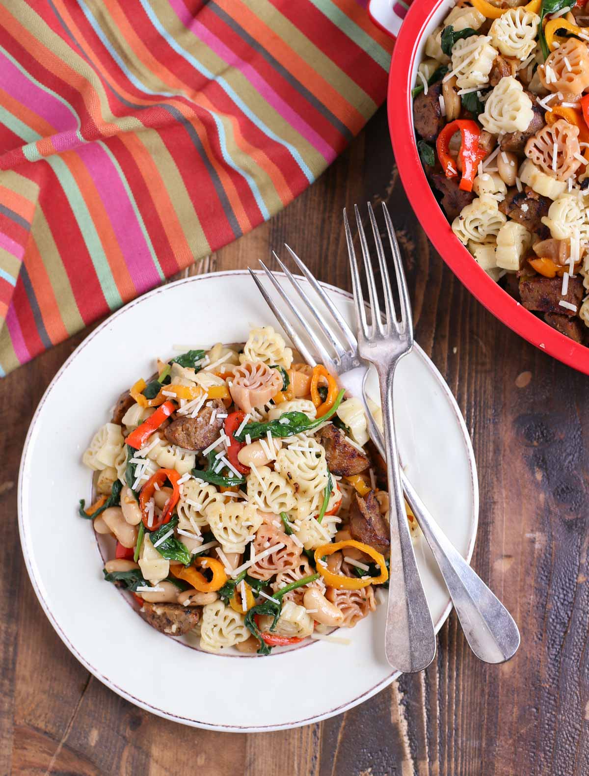 Veggie Sausage and Sweet Peppers with Turkey Pasta - a Thanksgiving Alternative! | Vegan Sausage, onions, colorful sweet peppers, fresh spinach and cannellini beans combine to make a delicious and hearty dish! | Add something new to your menu! | WorldofPastabilities.com