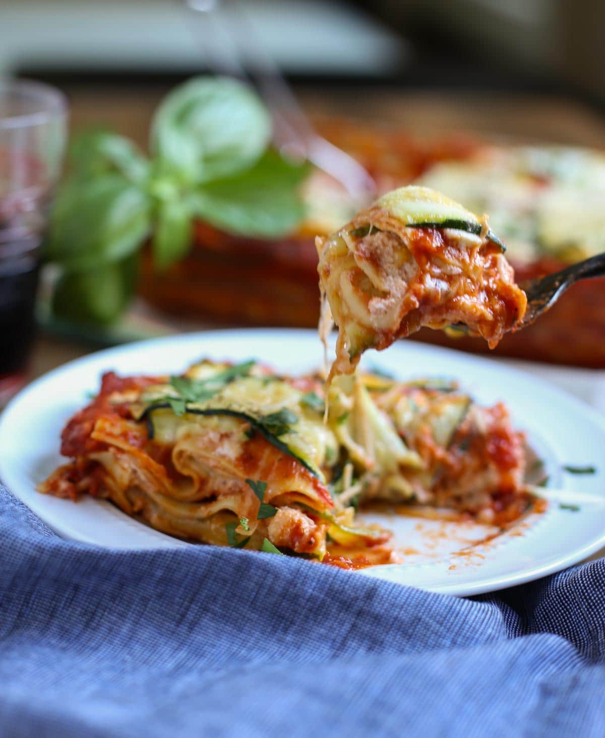 Zucchini Lasagna | Have you ever seen such a pretty lasagna? The Zucchini ribbons woven into a lattice pattern adds to the decadent taste of this dish! A crowd favorite for any event! WorldofPastabilities.com